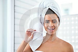 Theres no excuse not to brush to brush your teeth. a beautiful young woman brushing her teeth at home.