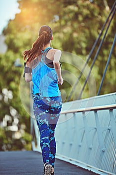 Theres only one way to start your day. a young woman out in the city for her morning run.