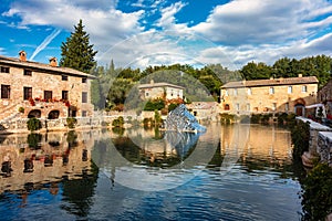 Thermal bath town of Bagno Vignoni, Italy during sunrise. Old thermal baths in the medieval village Bagno Vignoni, Tuscany, Italy