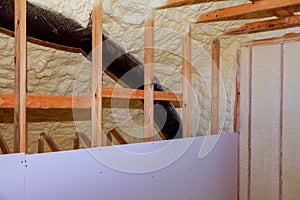 Inside wall insulation in wooden house, building under construction