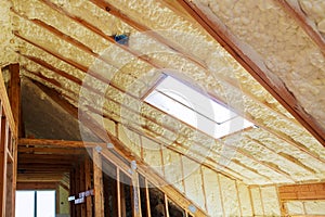 Inside wall insulation in wooden house, building under construction photo
