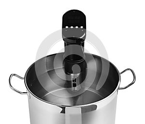 Thermal immersion circulator in pot isolated on white, closeup. Sous vide cooker