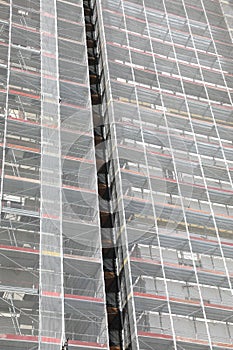 Thermal insulation and energy saving works on a skyscraper photo