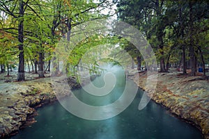 Thermal lagoon under deep sky , Blurred photo of morning fog over a lake in cold autumn weather in half moon san luis potosi