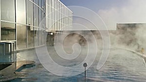 Thermal pool outdoor - a lot of steam over watersurface