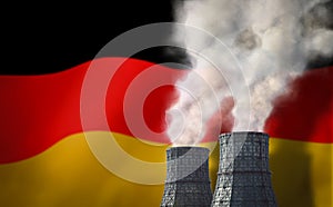 Thermal power plant on the background of the flag of Germany. White smoke from pipes with copy space