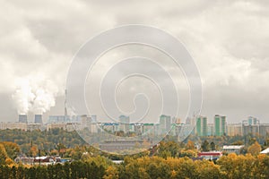 Thermal power station in the city in the autumn and smog the air