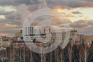 Thermal power station with steaming pipes evening view in Moscow