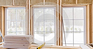 Thermally insulating eco-wood frame house with wood fiber plates and heat-isolating natural hemp material. Finishing the