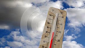 Thermometer on blue sky and shining sun illustration