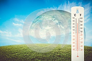 Thermometer check the earth& x27;s temperature with impact of global.