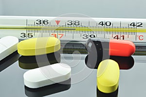 Thermometer and different pills and capsule