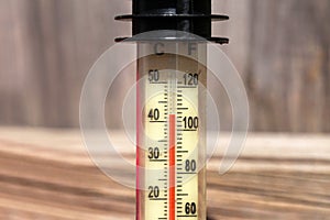 Thermometer displaying high 40 degree hot temperatures in summer day