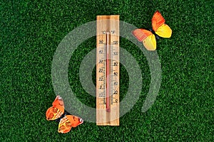 Thermometer displaying high 40 degree hot temperatures in sun summer day