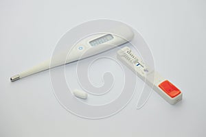 Thermometer and antigen test of COVD-19 photo