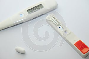 Thermometer and antigen test of COVD-19 photo