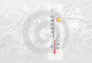 Thermometer on a frozen window shows minus 7 degrees celsius