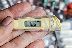 Thermometer in hand temperature tablets