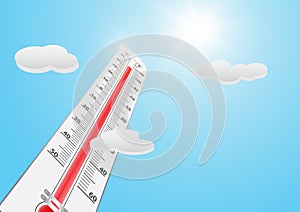 Thermometer with high temperature against the sun on blue sky background