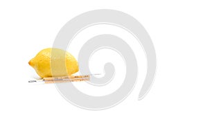 Thermometer with lemon on white background.