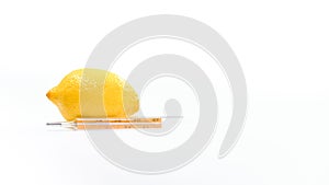 Thermometer with lemon on white background. Vitamins are important for immunity.