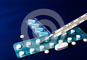 Thermometer and pill and medical equipment background