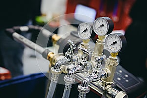 Thermometer, pipes and faucet valves of heating system in a boiler room