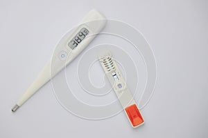 thermometer and antigen test of COVD-19 photo