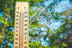 Thermometer shows higt temperatures in celsius or farenheit.