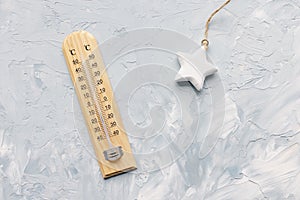 Thermometer shows low air temperature. Winter weather concept