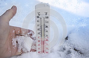 Thermometer on snow shows freezing temperature in celsius or farenheit