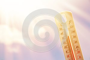 Thermometer. Summer heat or global warming climate change concept