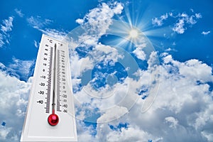 Thermometer Sun high Degres. Hot summer day. High Summer temperatures photo