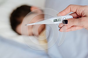 Thermometer to measure the heat temperature of a sick child