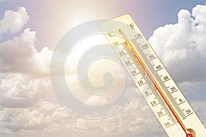 Thermometer in very hot day, high temperature or warm environment concept.