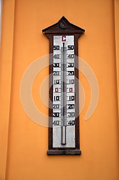 Thermometer on the yellow wall