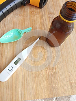 the thermometers and small bottles with medicines