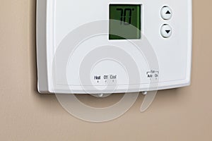 Thermostat for home furnace and air conditioner .