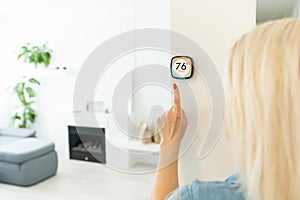 Thermostat smart home domotic control panel on wall for winter house temperature banner panoramic. Energy saving hand