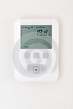 Thermostat on white wall