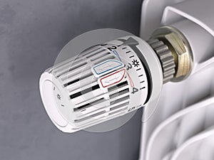 Thermostatic radiator valve close up. Temperature control and consumption saving photo