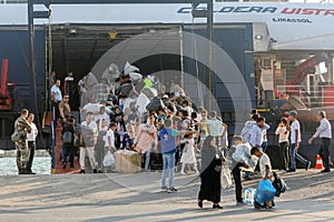 Refugees and migrants disembark to the port of Thessaloniki after being transfered from the refugee camp of Moria, Lesvos island