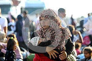 Refugees and migrants disembark to the port of Thessaloniki after being transfered from the refugee camp of Moria, Lesvos island