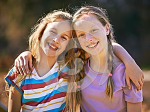 Theyre the best of friends. Portrait of two young girls standing together in the outdoors.