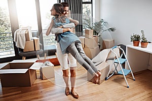 Theyre excited for the future. Full length shot of an attractive young woman and her daughter dancing while moving into