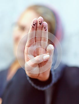 Theyre a happy finger family. fingers with smileys drawn on them.