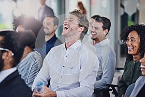 Theyre having a great time in the conference room. a group of businesspeople laughing during a seminar in the conference