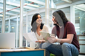 Theyre hell-bent on transforming the design landscape. two businesspeople having a discussion in an office.