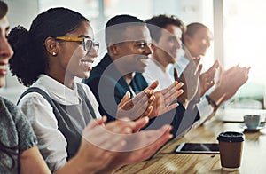 Theyre impressed. a group of young businesspeople applauding while sitting in the conference room during a seminar.