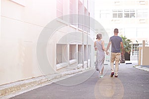 Theyre inseparable...a young couple taking a walk outdoors.